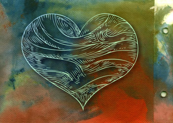 A filigree heart against art paper with bright and dark splashes of color; healing concept